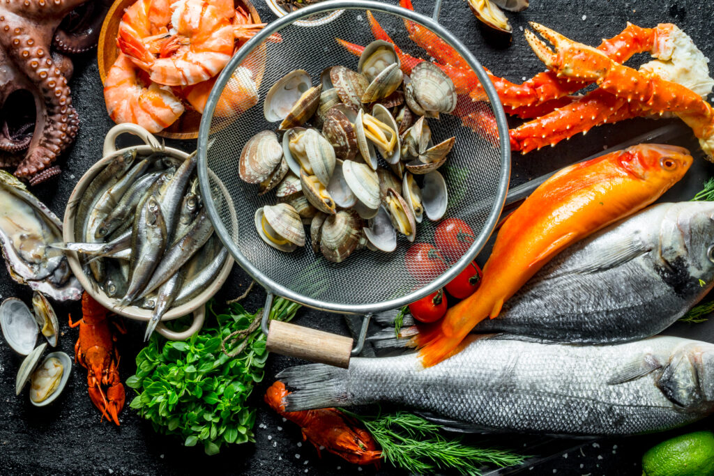 Seafood. Oysters, fresh fish, shrimp, crab with aromatic herbs Top view