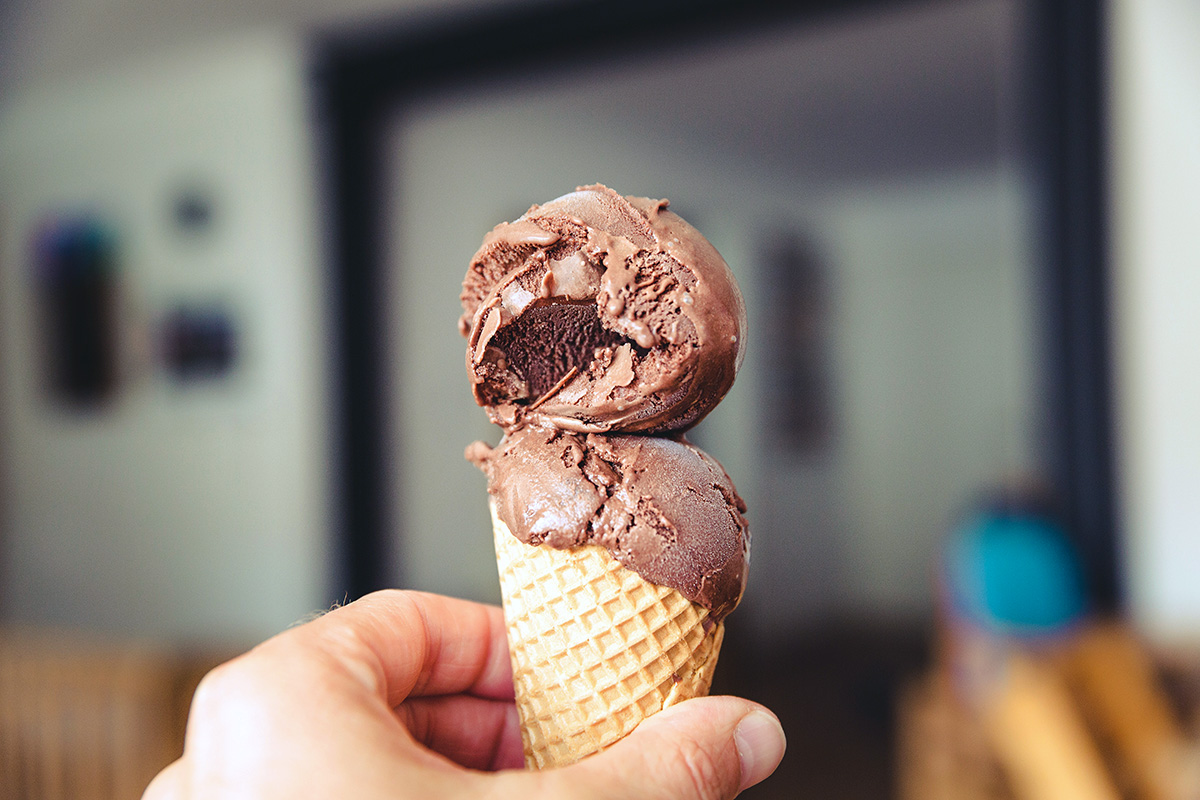 2 scoops of chocolate ice-cream on a cone